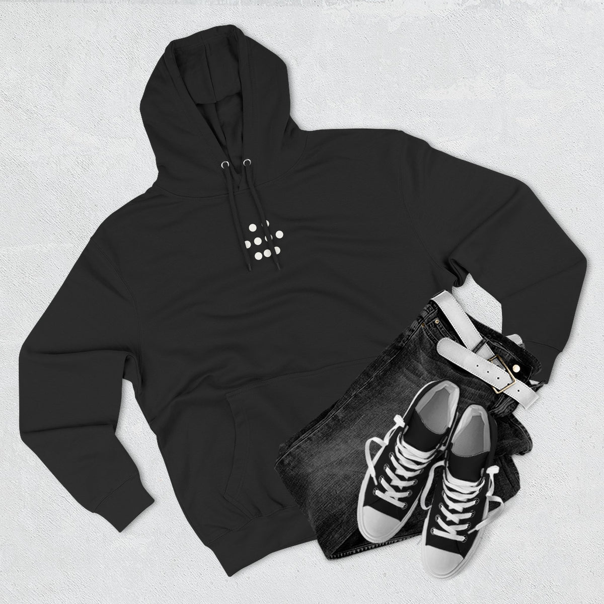 Black nine-dot hoodie shown in a flat lay