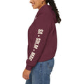 Maroon SA · SDLM · MAC hoodie showing bone lettering down the left sleeve.